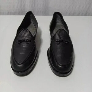 Stuart Weitzman Black Leather with bow slip on loafer. Ladies size 7 NARROW